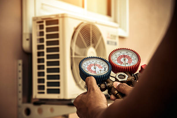 Professional Heat Pump Repair technician working in Advance, NC